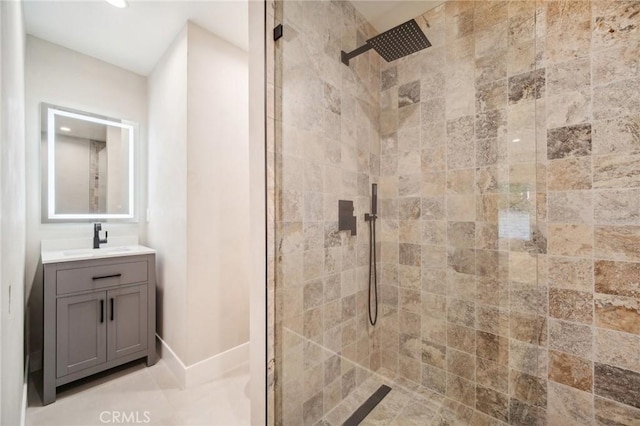 bathroom featuring vanity and a tile shower