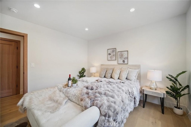 bedroom with light hardwood / wood-style flooring