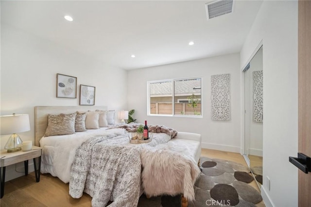 bedroom with light hardwood / wood-style flooring