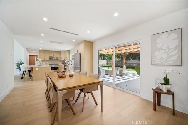 dining area with light wood-type flooring