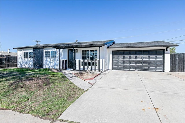 ranch-style house with a garage and a front yard