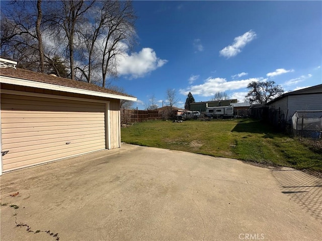 garage featuring a yard