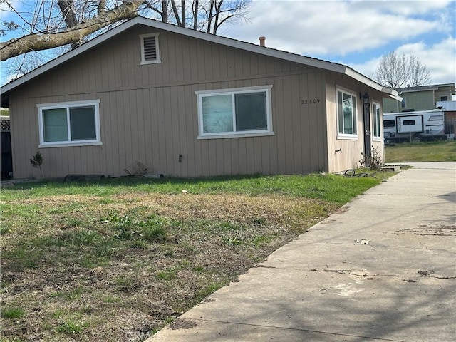 view of home's exterior featuring a yard