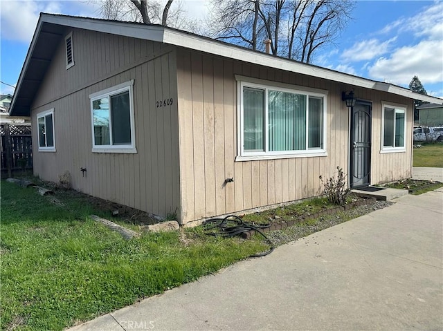 view of property exterior featuring a yard