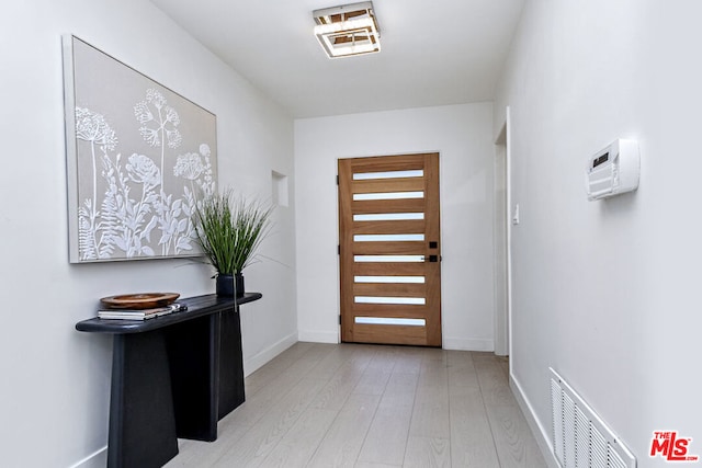 foyer with light wood-type flooring