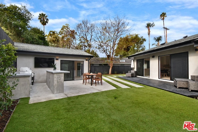 view of yard featuring area for grilling and a patio area