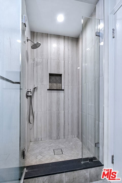 bathroom featuring an enclosed shower