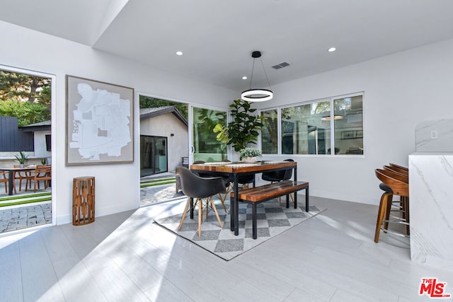 dining space with light wood-type flooring