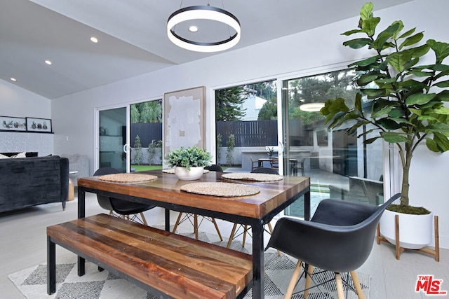 dining space with lofted ceiling