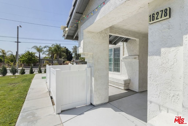 doorway to property featuring a yard