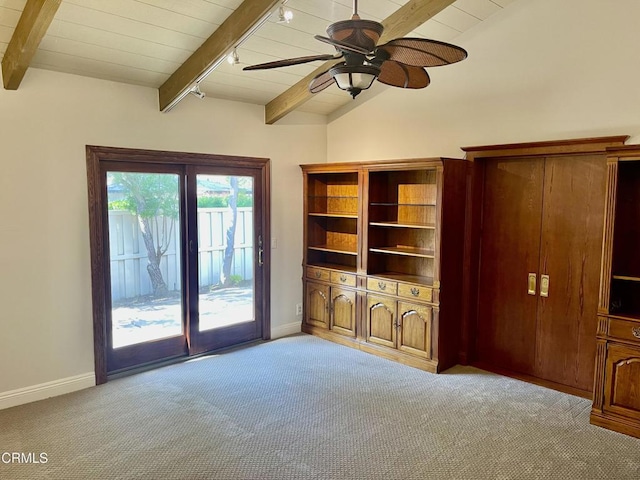 carpeted living room with vaulted ceiling with beams, wooden ceiling, rail lighting, and ceiling fan