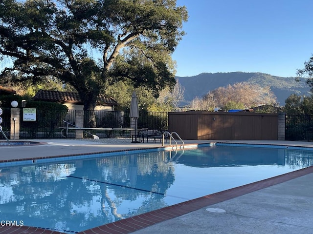 view of pool with a mountain view