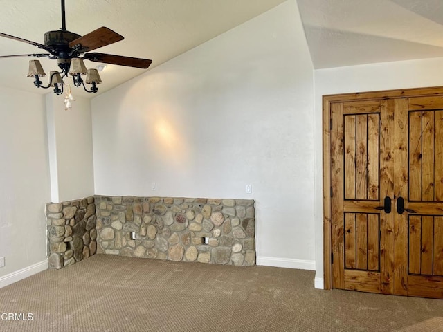 interior space with carpet flooring and ceiling fan