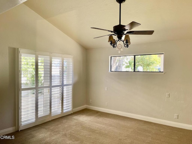 unfurnished room with ceiling fan, vaulted ceiling, and light carpet