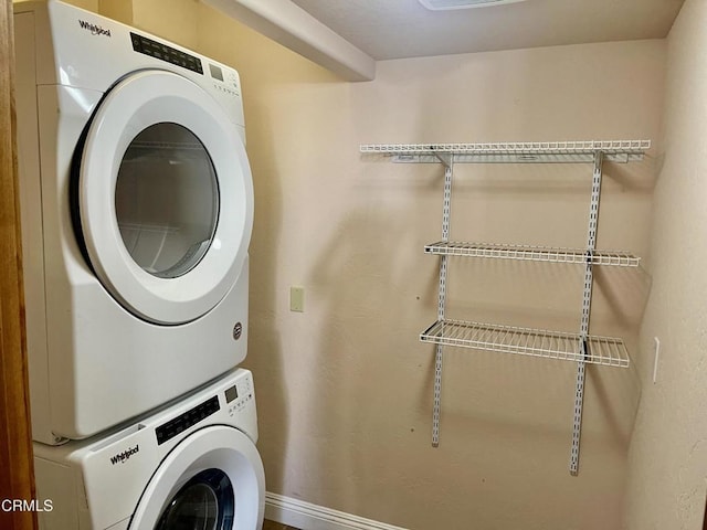 laundry room with stacked washer and dryer