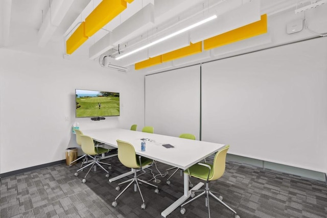 carpeted home office with an AC wall unit