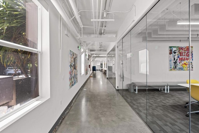 hallway featuring concrete flooring