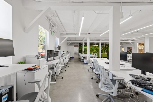 home office featuring concrete floors