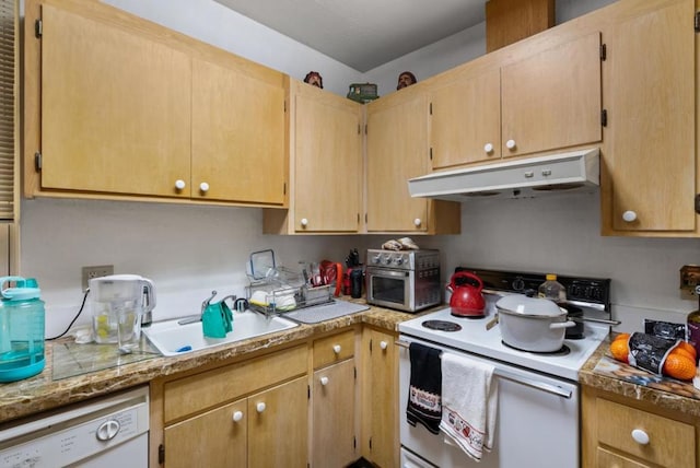 kitchen with light brown cabinets and white appliances