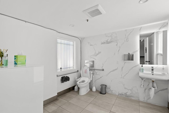 bathroom with sink, tile patterned floors, and toilet