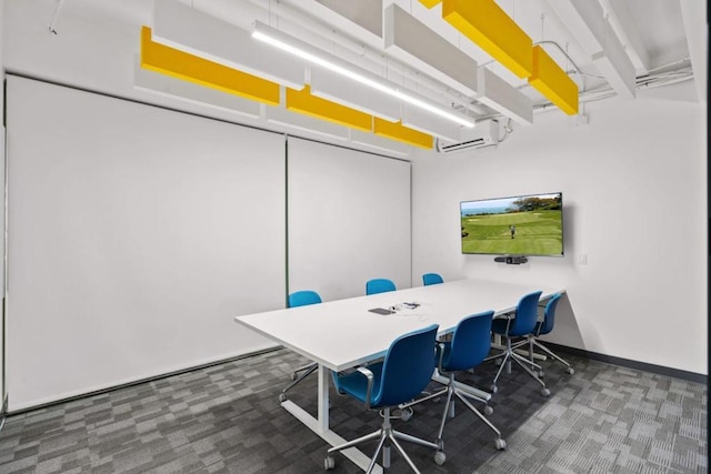 carpeted home office featuring a wall unit AC