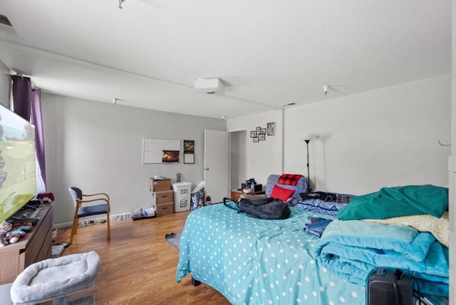 bedroom featuring light wood-type flooring