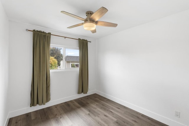 spare room featuring hardwood / wood-style flooring and ceiling fan