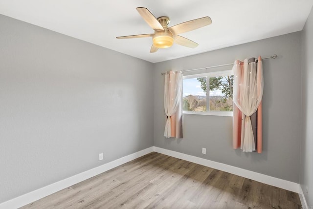 unfurnished room with ceiling fan and light hardwood / wood-style floors