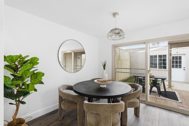 dining area with dark hardwood / wood-style floors