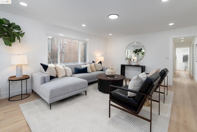 living room with light hardwood / wood-style flooring