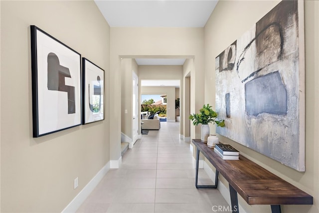 hall with light tile patterned floors