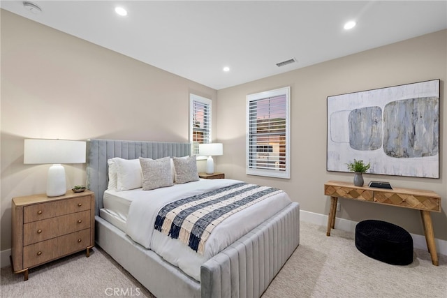 bedroom with light colored carpet