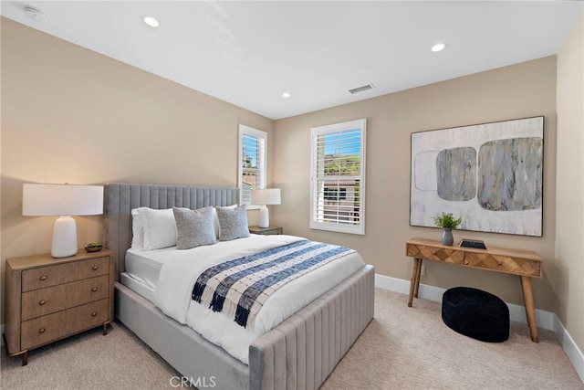 bedroom featuring light colored carpet