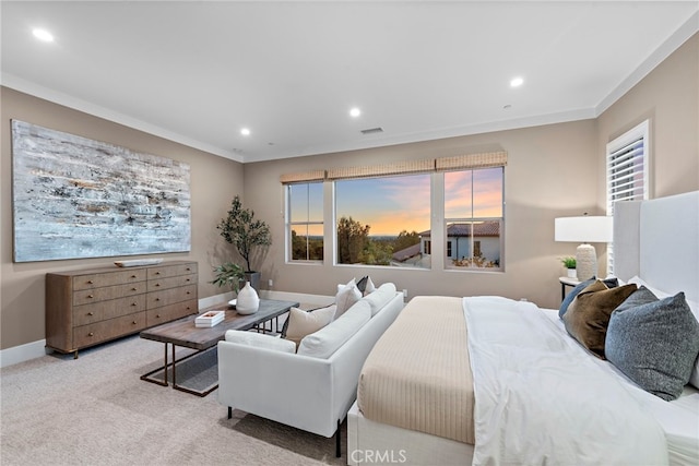 carpeted bedroom featuring ornamental molding and multiple windows