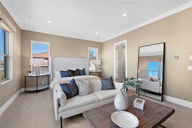 bedroom with crown molding and light colored carpet