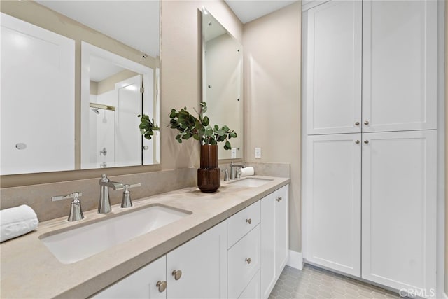 bathroom featuring vanity and a shower