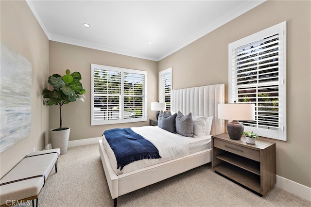 bedroom with light carpet and ornamental molding