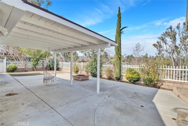 view of patio / terrace with a fire pit and a fenced backyard