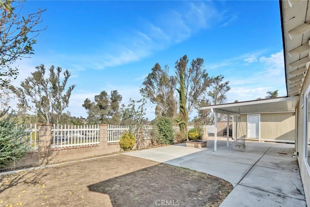 view of yard featuring a patio area and a fenced backyard