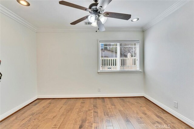 spare room featuring crown molding, ceiling fan, and light hardwood / wood-style flooring