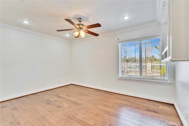 unfurnished room with ornamental molding, ceiling fan, and light wood-type flooring