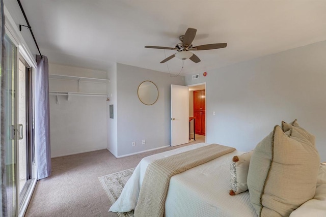 bedroom with light carpet, multiple windows, a closet, and ceiling fan