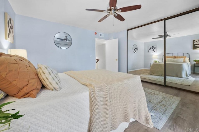3575 Monair Dr Unit C, San Diego, CA 92117 - bedroom featuring wood finished floors, ceiling fan, and a closet