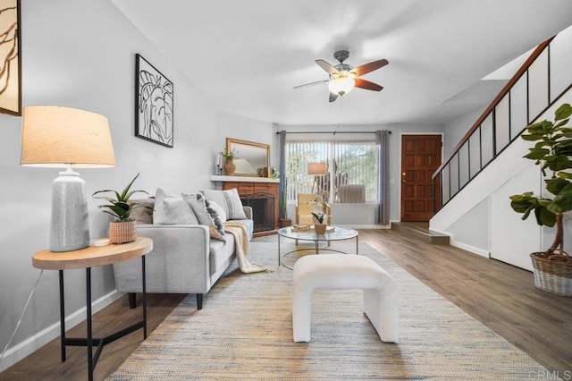 3575 Monair Dr Unit C, San Diego, CA 92117 - living area featuring ceiling fan, wood finished floors, stairway, and baseboards