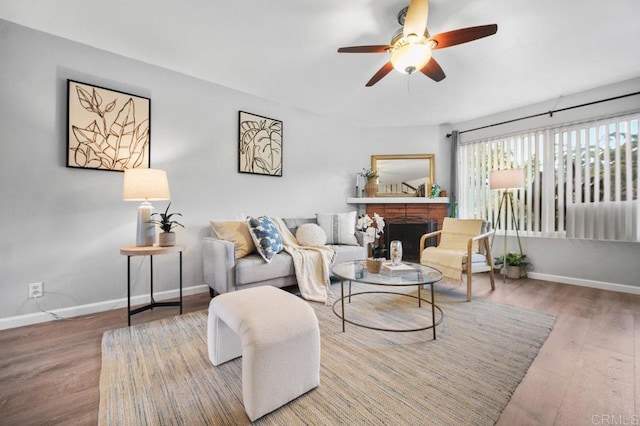 3575 Monair Dr Unit C, San Diego, CA 92117 - living room with ceiling fan, baseboards, a fireplace, and wood finished floors