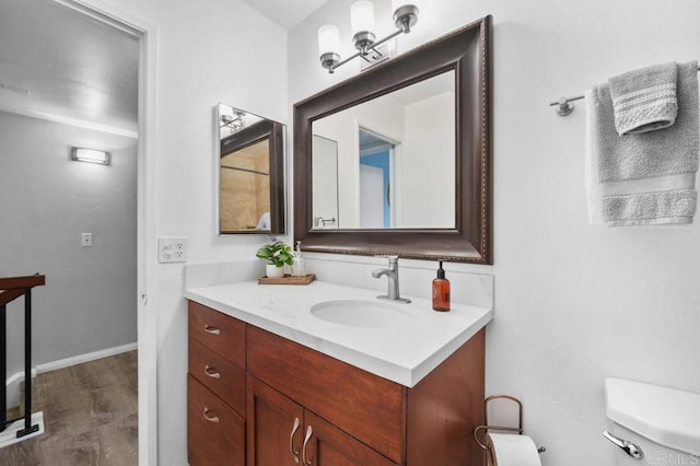 3575 Monair Dr Unit C, San Diego, CA 92117 - bathroom featuring vanity, wood finished floors, toilet, and baseboards