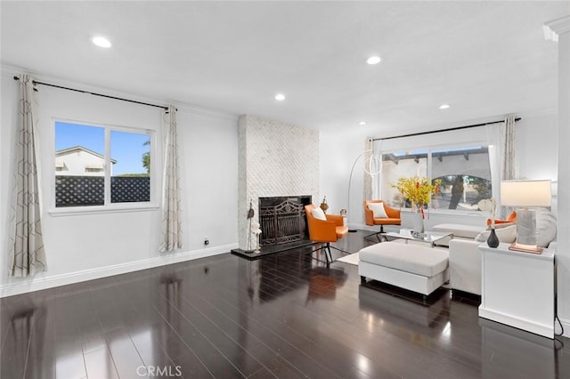 sitting room with dark wood-type flooring and a fireplace