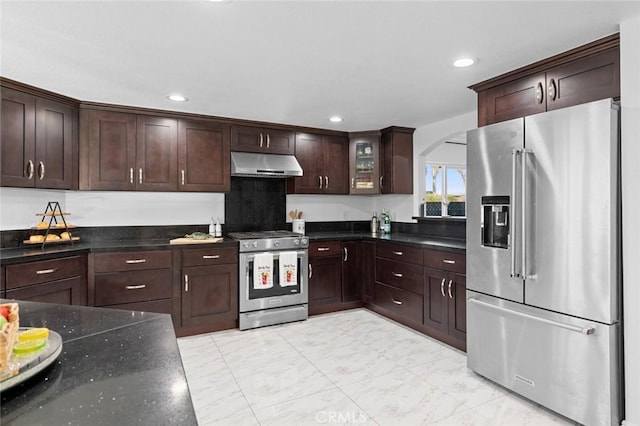 kitchen featuring appliances with stainless steel finishes and dark brown cabinetry