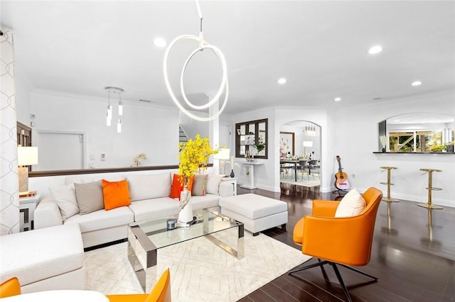 living room featuring hardwood / wood-style flooring and crown molding