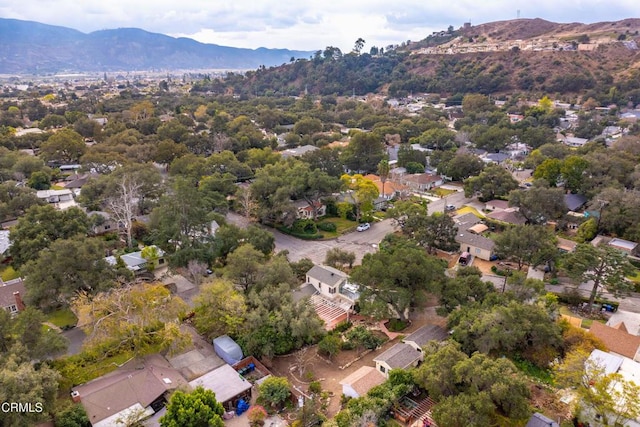 birds eye view of property with a mountain view